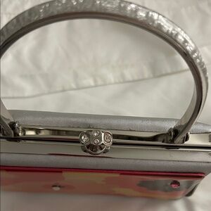 Elegant Silver and Red Clutch